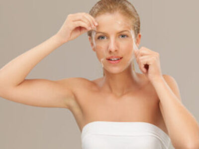 Women peeling mask from face